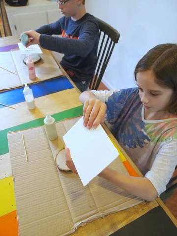 Kids can have fun making sand art paintings, too!